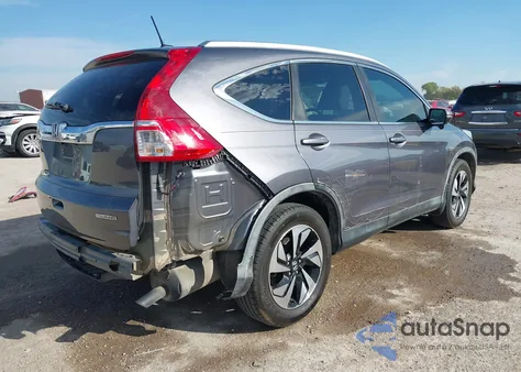 2015 Honda Cr-V Touring z USA, uszkodzony, nr VIN 5J6RM3H94FL020849